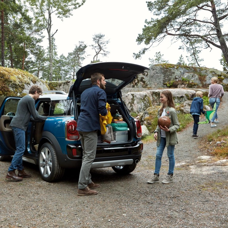 MINI Countryman boot space is getting unpacked by a Family of five